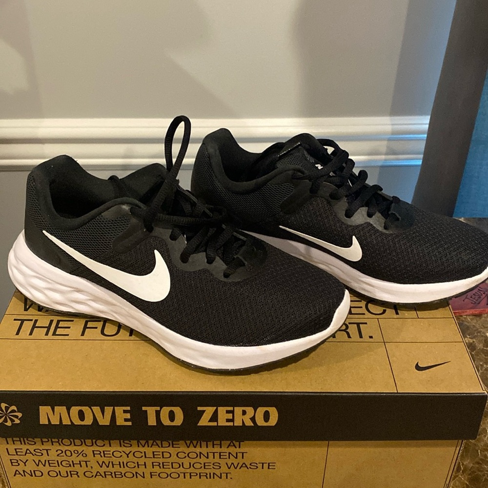 Women Nike Revolution size 6 black with white soles